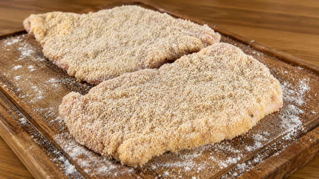 schnitzel-empanado-para-a-fritura-1024x576 Schnitzel Suíno: O Clássico Bife Empanado Alemão Crocante e Suculento